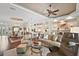 Spacious living room with open floor plan and views of the kitchen and dining room at 8732 Providence Ct, Mount Dora, FL 32757
