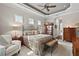 Spacious main bedroom with seating area and large windows at 8732 Providence Ct, Mount Dora, FL 32757