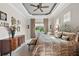 Relaxing main bedroom with a king-size bed and dresser at 8732 Providence Ct, Mount Dora, FL 32757