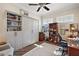 Bright office with built-in shelves and desk at 8732 Providence Ct, Mount Dora, FL 32757