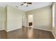 Bedroom with wood floors and access to bathroom at 34416 Tuscany Ave, Sorrento, FL 32776