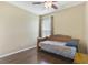 Bedroom with wood floors and daybed at 34416 Tuscany Ave, Sorrento, FL 32776