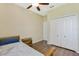 Bedroom with wood floors and double doors at 34416 Tuscany Ave, Sorrento, FL 32776