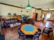 Community room with fireplace and game tables at 34416 Tuscany Ave, Sorrento, FL 32776