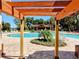 Pool area with pergola and lounge chairs at 34416 Tuscany Ave, Sorrento, FL 32776
