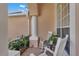 Cozy outdoor patio with rocking chairs, perfect for relaxing and enjoying the serene surroundings at 13129 Coldwater Loop, Clermont, FL 34711