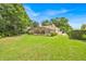 Large backyard showcasing the home's screened-in pool area and ample green space at 2602 Tryon Pl, Windermere, FL 34786