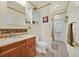 Well-lit bathroom featuring a wooden vanity, modern fixtures, and a walk-in shower at 2602 Tryon Pl, Windermere, FL 34786