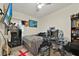 Bedroom featuring light walls, ceiling fan and tv mounted on the wall at 2602 Tryon Pl, Windermere, FL 34786