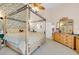 Charming primary bedroom featuring a four-poster bed, floral wallpaper, and a lovely wooden dresser at 2602 Tryon Pl, Windermere, FL 34786
