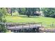 A picturesque wooden bridge provides a charming focal point over a tranquil waterway at 2602 Tryon Pl, Windermere, FL 34786