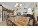 Open dining area connecting the kitchen, living room and featuring a large wood table at 2602 Tryon Pl, Windermere, FL 34786