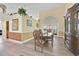 Elegant dining room featuring wood floors, a large table, and a decorative hutch at 2602 Tryon Pl, Windermere, FL 34786