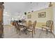 Elegant dining room featuring wood floors, a large table, and a decorative hutch at 2602 Tryon Pl, Windermere, FL 34786