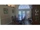 Dining room has wood floors, a decorative hutch, and arched windows offering natural light at 2602 Tryon Pl, Windermere, FL 34786