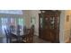 Elegant dining room showcasing wood floors, a large hutch and natural light, perfect for gatherings at 2602 Tryon Pl, Windermere, FL 34786