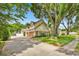 Attractive two-story home with a three-car garage, brick accents, and a well-maintained lawn and landscaping at 2602 Tryon Pl, Windermere, FL 34786
