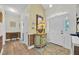 Welcoming foyer featuring elegant tile flooring, a decorative table, and a large front door at 2602 Tryon Pl, Windermere, FL 34786