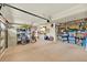 Spacious and organized garage with ample storage space, shelving, and room for multiple vehicles at 2602 Tryon Pl, Windermere, FL 34786