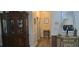 Hallway features a wood floor and views of architectural details including a hutch and decor at 2602 Tryon Pl, Windermere, FL 34786