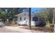 Charming historical building, featuring well-kept landscaping and a sidewalk for pedestrian access at 2602 Tryon Pl, Windermere, FL 34786