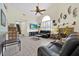 Living room with tile floors, a brick fireplace, and a vaulted ceiling at 2602 Tryon Pl, Windermere, FL 34786