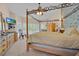 Large main bedroom suite featuring vaulted ceiling, four poster bed and large window at 2602 Tryon Pl, Windermere, FL 34786