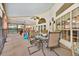 Bright screened patio featuring a dining table, outdoor seating, and a pool table at 2602 Tryon Pl, Windermere, FL 34786