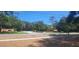 Community entrance sign amidst mature trees and landscaping creating a welcoming atmosphere at 2602 Tryon Pl, Windermere, FL 34786