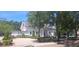 Charming town hall featuring a classic facade, manicured landscaping, and a welcoming entrance at 2602 Tryon Pl, Windermere, FL 34786