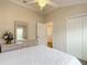 Comfortable bedroom with large closet and ensuite access at 2673 Beckett Run, The Villages, FL 32162