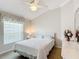 Bedroom with vaulted ceiling, ceiling fan and large window at 2673 Beckett Run, The Villages, FL 32162