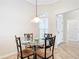 Breakfast nook with glass table and chairs, near entryway at 2673 Beckett Run, The Villages, FL 32162