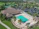 Resort-style community pool with lounge chairs at 2673 Beckett Run, The Villages, FL 32162