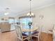 Formal dining room with a chandelier and hardwood floors at 2673 Beckett Run, The Villages, FL 32162