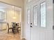 The entryway looks toward a dining area and kitchen beyond at 2673 Beckett Run, The Villages, FL 32162