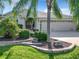 Front view of a single-story home showcasing its attractive facade and landscaping at 2673 Beckett Run, The Villages, FL 32162