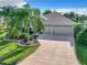 Attractive single-story home with landscaped yard and three-car garage at 2673 Beckett Run, The Villages, FL 32162