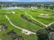 Aerial view of a scenic golf course with fairways and greens at 2673 Beckett Run, The Villages, FL 32162