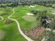 Aerial view of a lush green golf course with palm trees at 2673 Beckett Run, The Villages, FL 32162