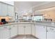 Kitchen features a large island and white cabinetry at 2673 Beckett Run, The Villages, FL 32162