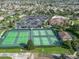 Aerial view of community tennis courts and clubhouse at 2673 Beckett Run, The Villages, FL 32162