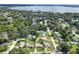 Wide aerial view of lakefront neighborhood, showing property location at 326 N Sunset Dr, Mount Dora, FL 32757