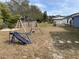 Backyard with playset and slide at 3726 Imperial Dr, Winter Haven, FL 33880