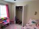 Bright bedroom with pink decor and closet at 3726 Imperial Dr, Winter Haven, FL 33880