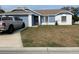 Well-maintained single-story home with a gray truck parked in the driveway at 3726 Imperial Dr, Winter Haven, FL 33880