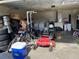 Garage with riding mower, bicycle and storage at 3726 Imperial Dr, Winter Haven, FL 33880