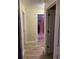 Hallway with doors to bedrooms and neutral decor at 3726 Imperial Dr, Winter Haven, FL 33880