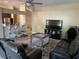 Open living area with a view into the kitchen and a baby play area at 3726 Imperial Dr, Winter Haven, FL 33880