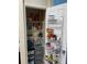 Well-organized pantry with ample shelving for food storage at 3726 Imperial Dr, Winter Haven, FL 33880